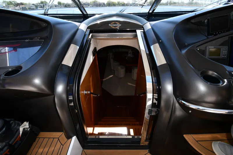 Slide: The Image of Interior view of 2002 Sunseeker 68 Predator yacht, featuring sleek design and wooden accents. - 41