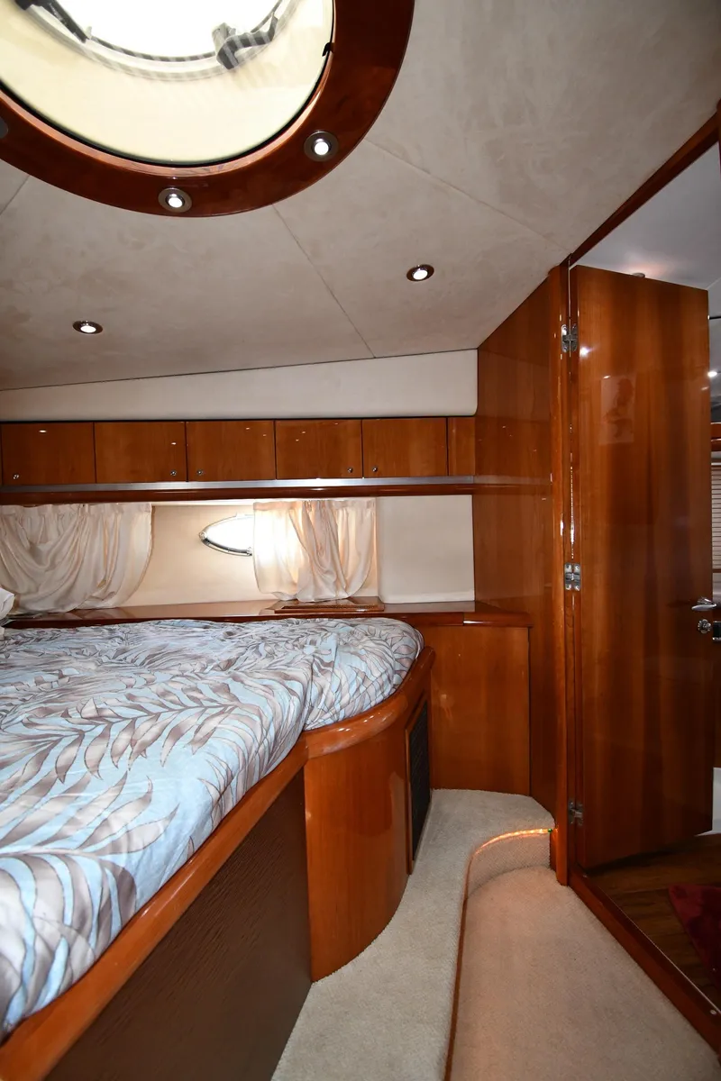 Slide: The Image of Luxurious cabin interior of 2002 Sunseeker 68 Predator yacht with wood finishes. - 44