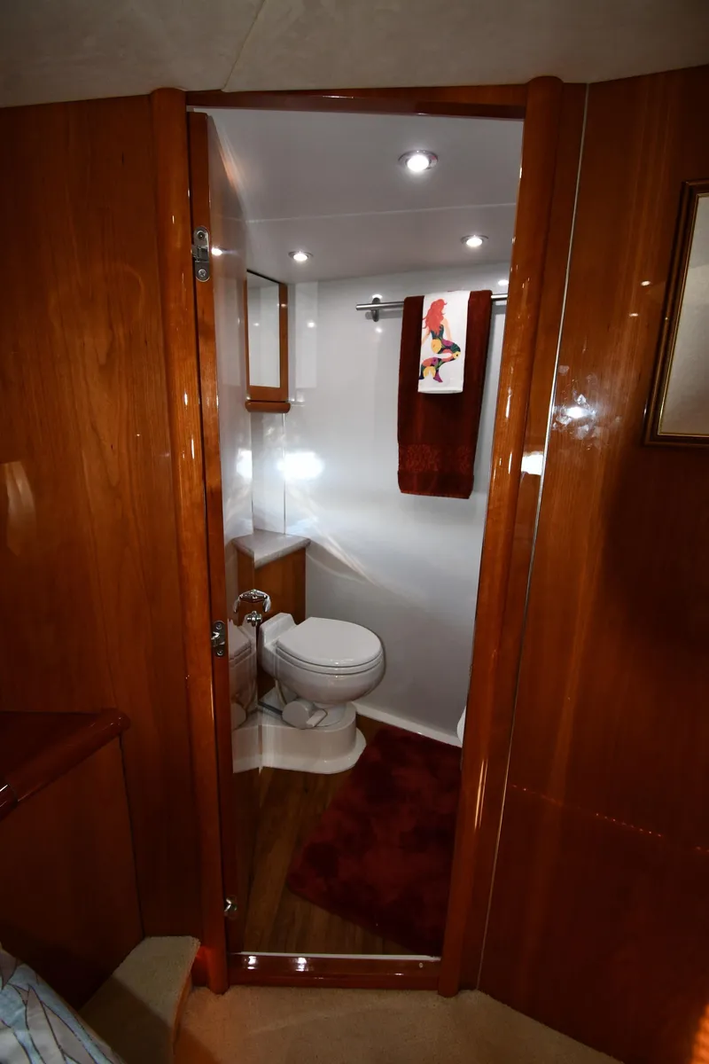 Slide: The Image of Luxurious bathroom interior of 2002 Sunseeker 68 Predator yacht with wooden finishes. - 48