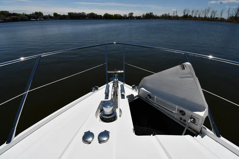 Slide: The Image of Bow view of 2002 Sunseeker 68 Predator yacht on calm water. - 8
