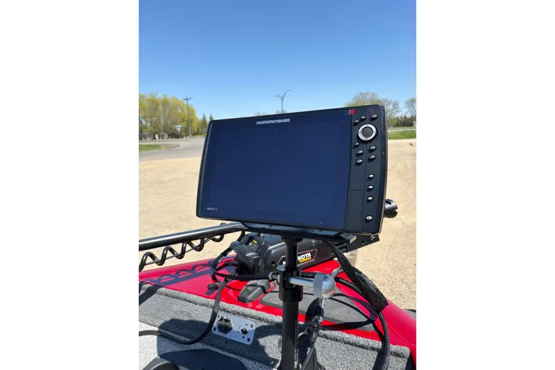 Slide: The Image of Fishfinder on 2021 Tracker Pro Team 175 TX boat, clear blue sky background. - 18