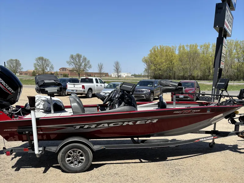 Slide: The Image of 2021 Tracker Pro Team 175 TX boat on trailer, parked outdoors. - 4