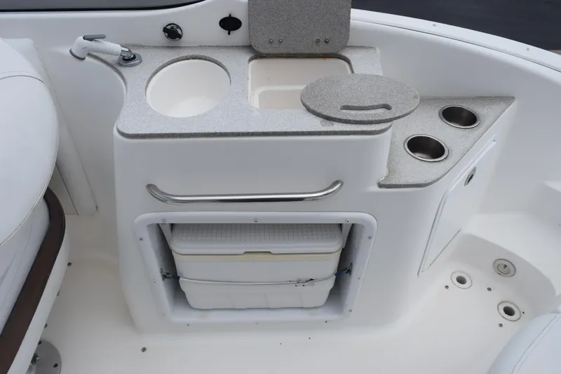 Slide: The Image of 2012 Hurricane SD2200 O/B boat sink and storage area with cup holders. - 11