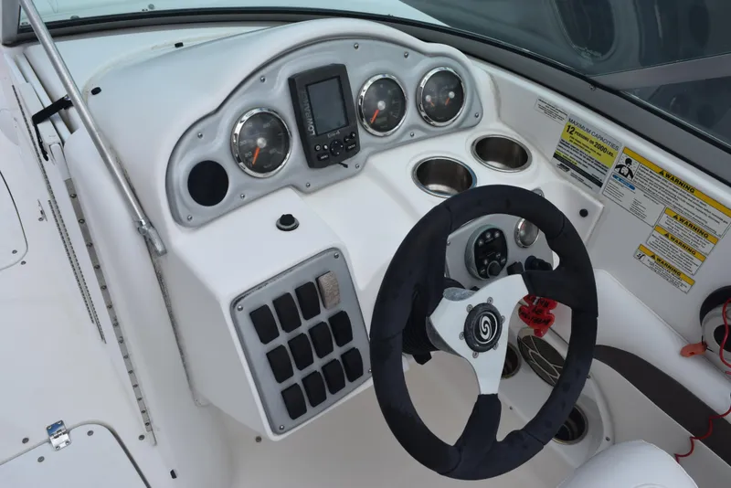 Slide: The Image of 2012 Hurricane SD2200 O/B boat dashboard with steering wheel and gauges. - 15