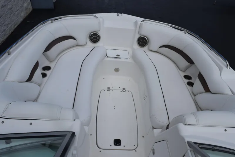 Slide: The Image of 2012 Hurricane SD2200 O/B boat interior with white seating and storage compartments. - 16