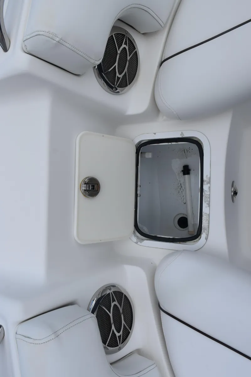 Slide: The Image of 2012 Hurricane SD2200 O/B boat interior with storage compartment and speakers. - 18