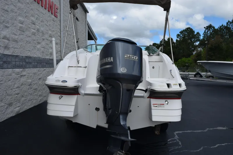 Slide: The Image of 2012 Hurricane SD2200 O/B boat with Yamaha 250 engine, parked outdoors. - 5