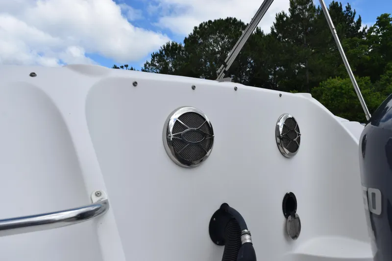 Slide: The Image of 2012 Hurricane SD2200 O/B boat speakers and fittings against a backdrop of trees and sky. - 8