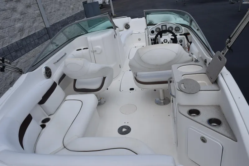 Slide: The Image of 2012 Hurricane SD2200 O/B boat interior with white seating and dashboard. - 9