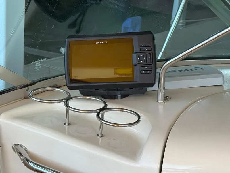Slide: The Image of Garmin GPS on 2002 Sea Ray 270 Sundeck dashboard with cup holders. - 10