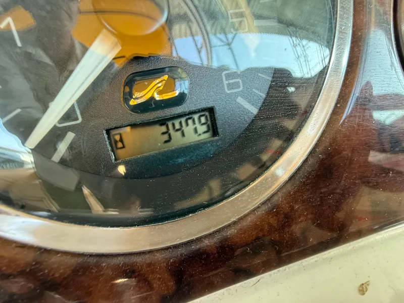 Slide: The Image of Close-up of a 2002 Sea Ray 270 Sundeck gauge displaying 3479 hours. - 11