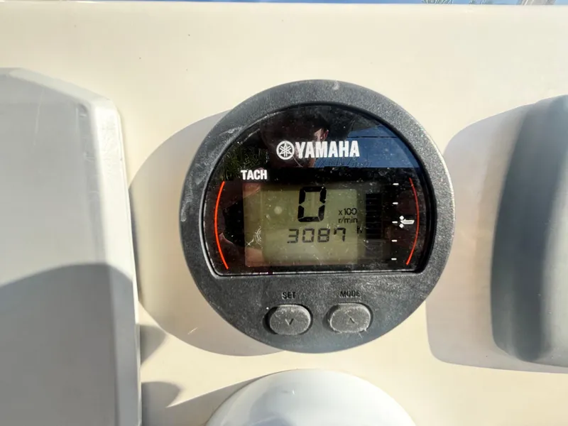 Slide: The Image of Yamaha tachometer on 2018 Key West 203 FS boat dashboard, displaying 0 RPM. - 18