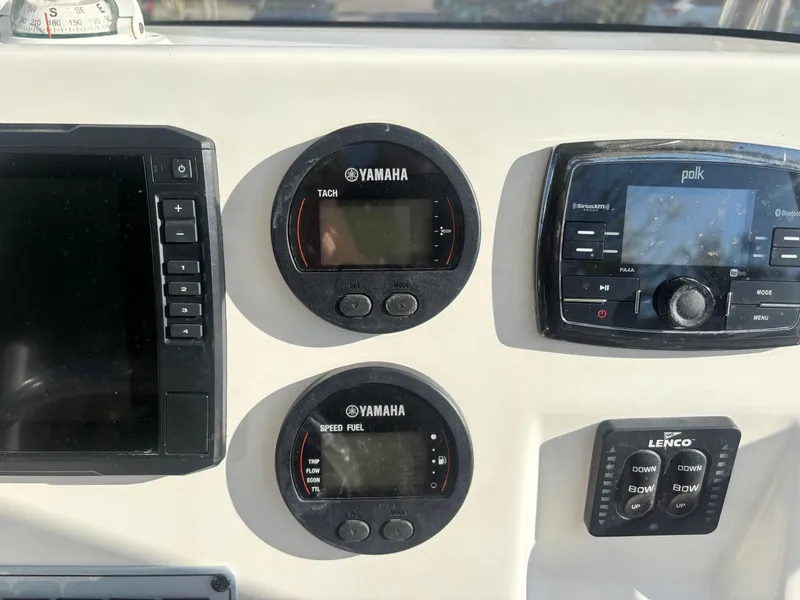 Slide: The Image of Dashboard of a 2018 Key West 203 FS boat with Yamaha gauges and Polk audio system. - 19