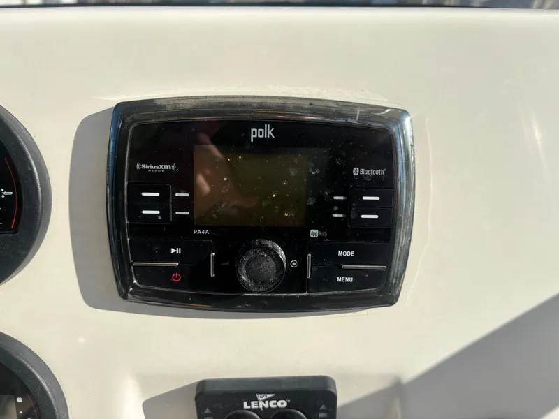Slide: The Image of Polk audio system on 2018 Key West 203 FS boat dashboard. - 20