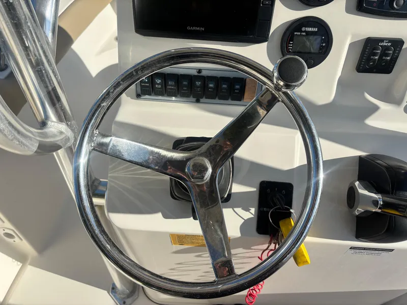 Slide: The Image of Steering wheel and controls of 2018 Key West 203 FS boat cockpit. - 22