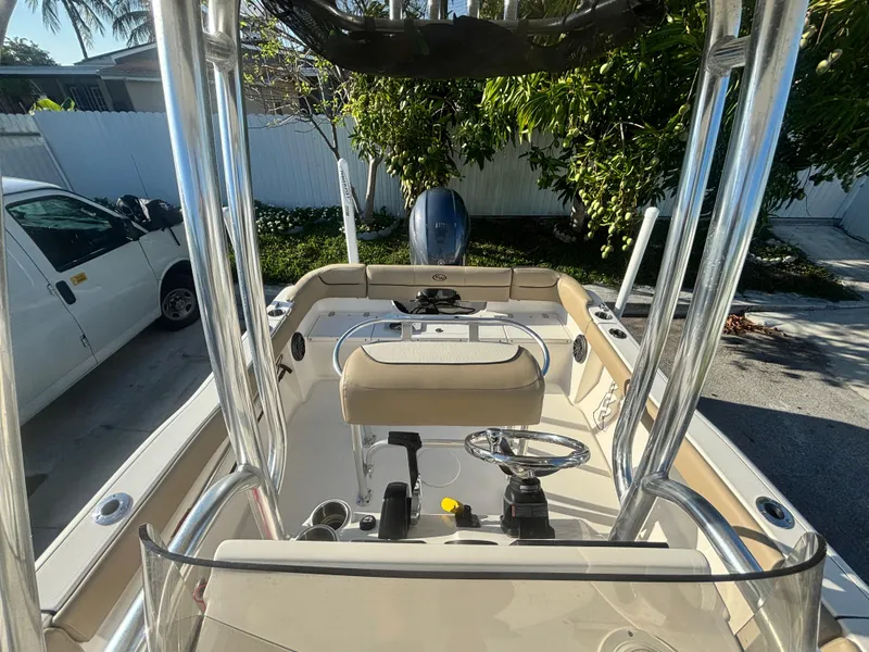 Slide: The Image of 2018 Key West 203 FS boat interior with steering console and seating. - 24