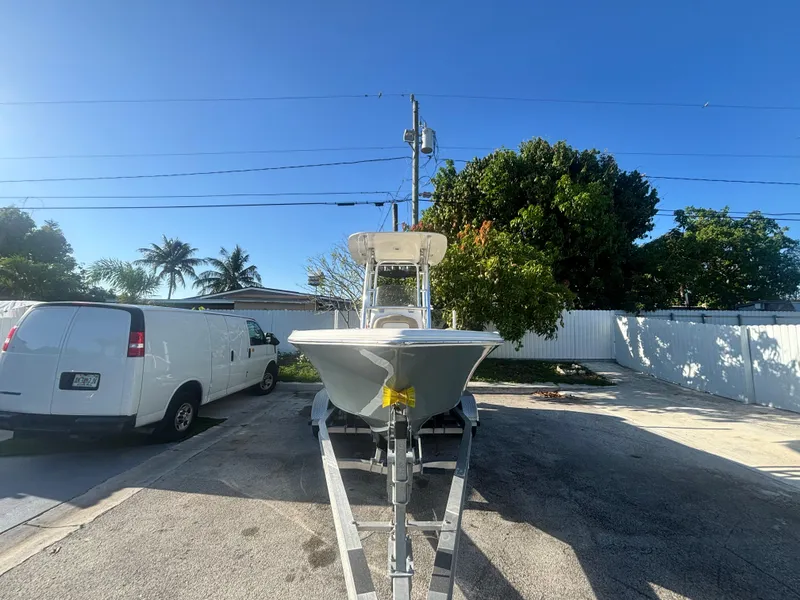 Slide: The Image of 2018 Key West 203 FS boat on trailer in sunny driveway. - 3