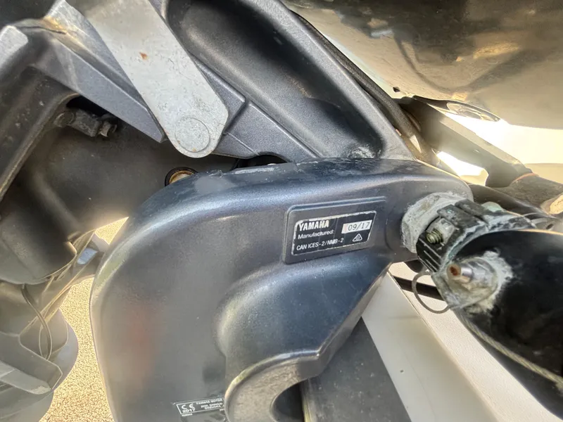 Slide: The Image of Close-up of a Yamaha motor part on a 2018 Key West 203 FS boat. - 34