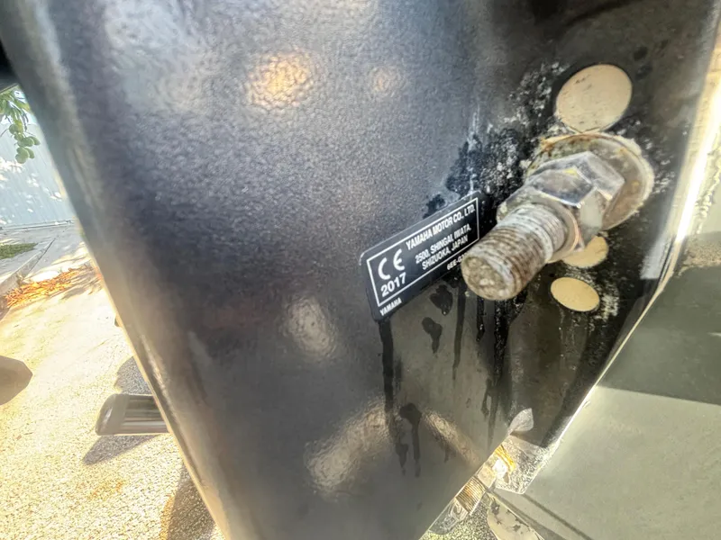 Slide: The Image of Close-up of a 2018 Key West 203 FS boat component with a visible bolt and label. - 35