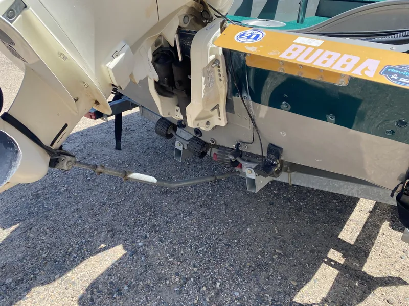 Slide: The Image of Rear view of a 2002 Lund 1650 Explorer boat with motor and decals. - 22