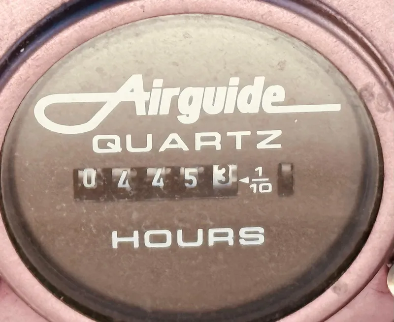 Slide: The Image of Airguide Quartz hour meter reading 445.3 hours on Regal 320 Commodore, 1997 model. - 14