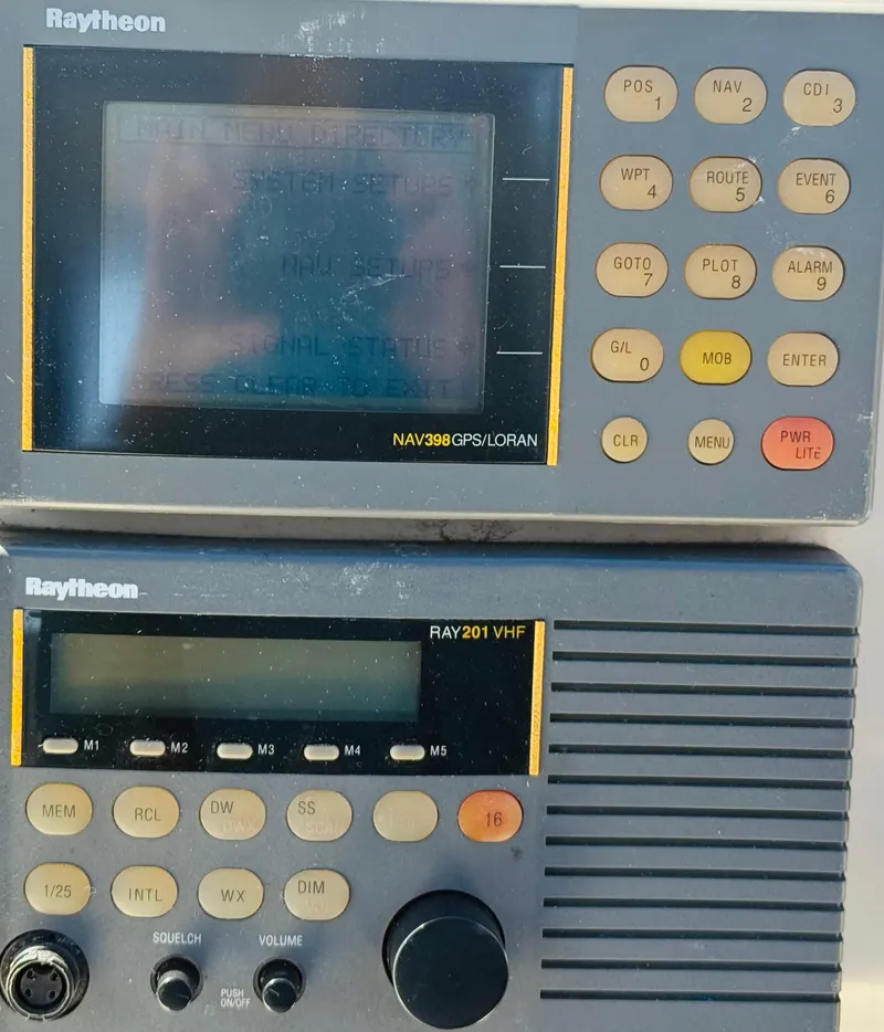 Slide: The Image of Raytheon NAV398 GPS and RAY201 VHF radio equipment on a 1997 Regal 320 Commodore. - 15