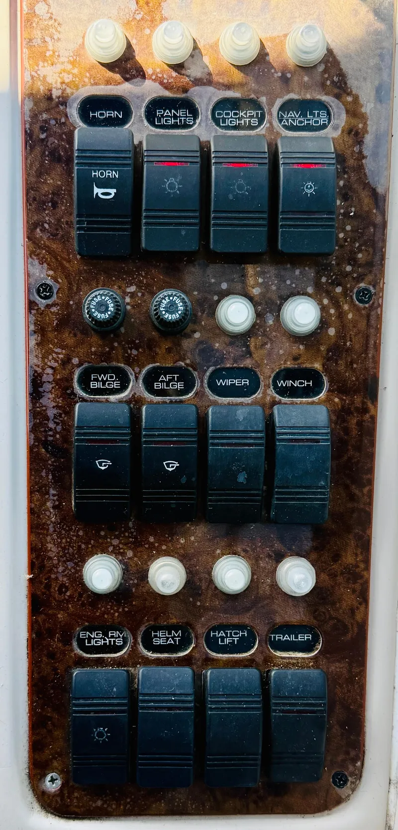 Slide: The Image of Control panel of a 1997 Regal 320 Commodore boat with various switches. - 16
