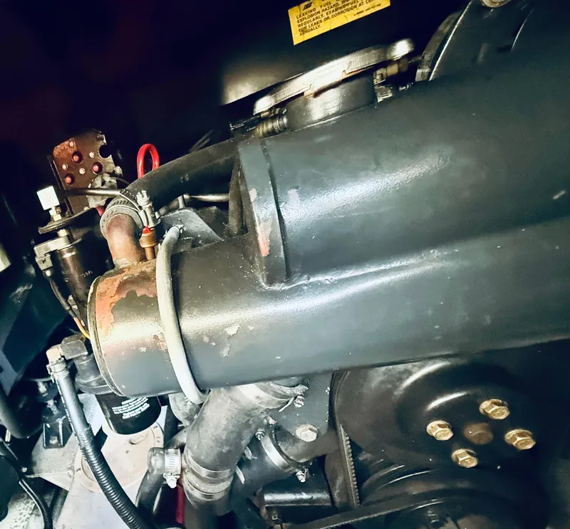 Slide: The Image of Engine of a 1997 Regal 320 Commodore boat, close-up view. - 35