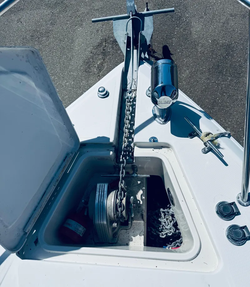 Slide: The Image of Anchor compartment of 1997 Regal 320 Commodore boat with chain and winch. - 5