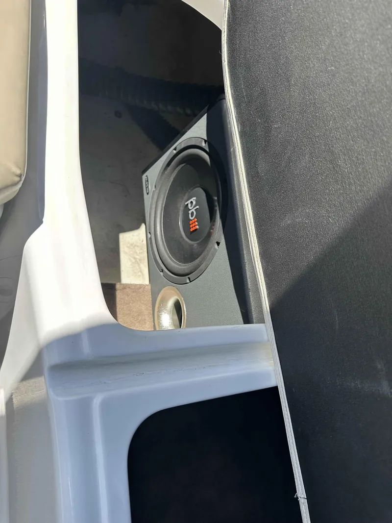 Slide: The Image of Speaker installed in a 2003 Glastron DX 235 boat interior. - 14