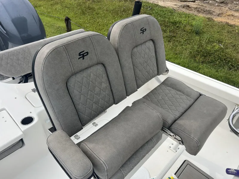 Slide: The Image of 2021 Sea Pro 228 Bay boat seats with gray upholstery and diamond stitching. - 3