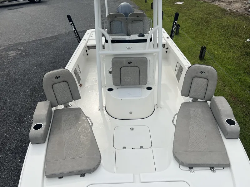 Slide: The Image of 2021 Sea Pro 228 Bay boat interior with gray seating and cup holders. - 5