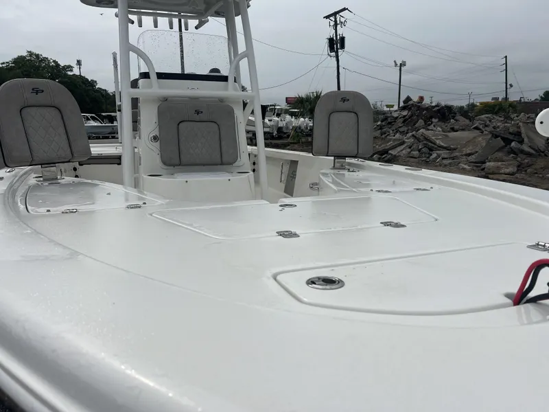 Slide: The Image of 2021 Sea Pro 228 Bay boat with seating and storage, overcast day. - 6