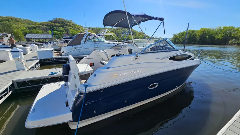 The Image of 2008 Regal 2565 Window Express boat docked at marina under clear blue sky. - 1
