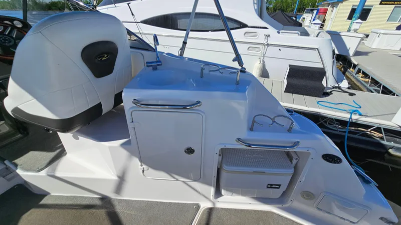 Slide: The Image of 2008 Regal 2565 Window Express boat interior with seating and storage compartments. - 8
