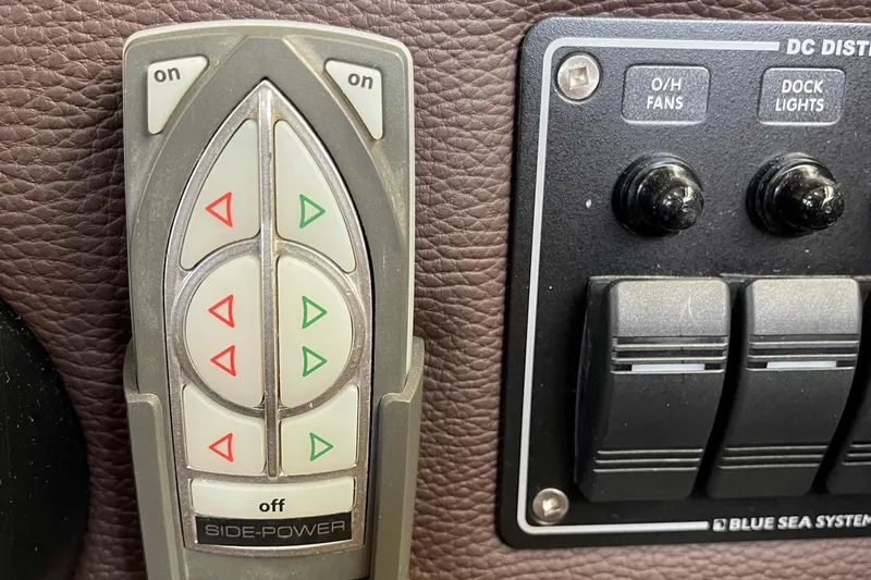 Slide: The Image of Control panel of a 2015 Cutwater C-28 boat with Side-Power and Blue Sea Systems switches. - 12