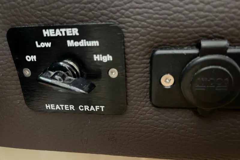 Slide: The Image of Heater control panel on 2015 Cutwater C-28 boat, featuring adjustable settings. - 13
