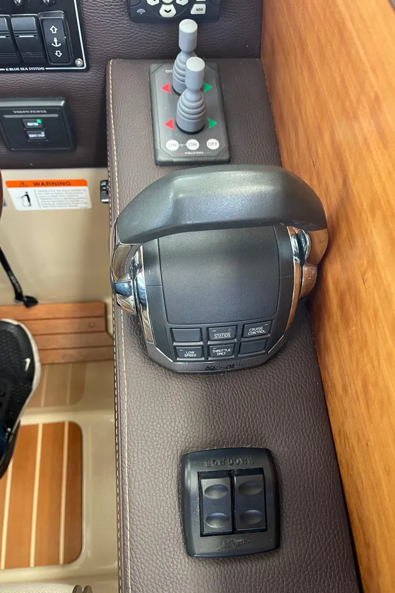 Slide: The Image of Control panel of a 2015 Cutwater C-28 boat with joystick and throttle controls. - 8
