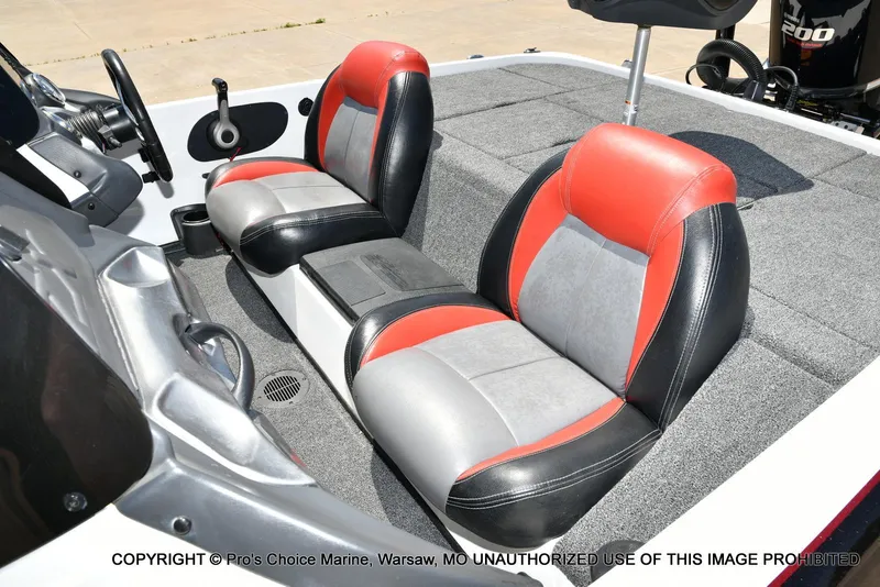 Slide: The Image of 2013 Skeeter ZX200 boat interior with red and gray seats. - 11