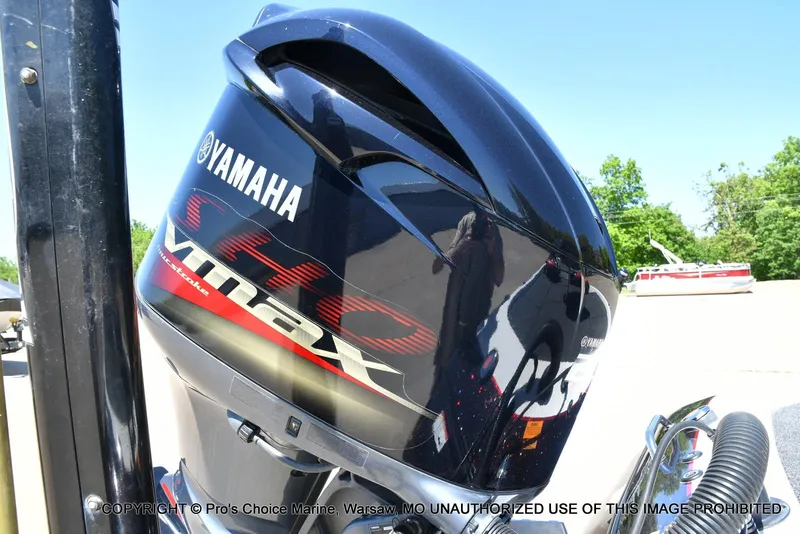 Slide: The Image of 2013 Skeeter ZX200 with Yamaha VMAX SHO outboard motor, parked outdoors. - 16