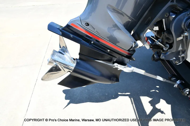 Slide: The Image of 2013 Skeeter ZX200 boat motor and propeller close-up on concrete surface. - 17