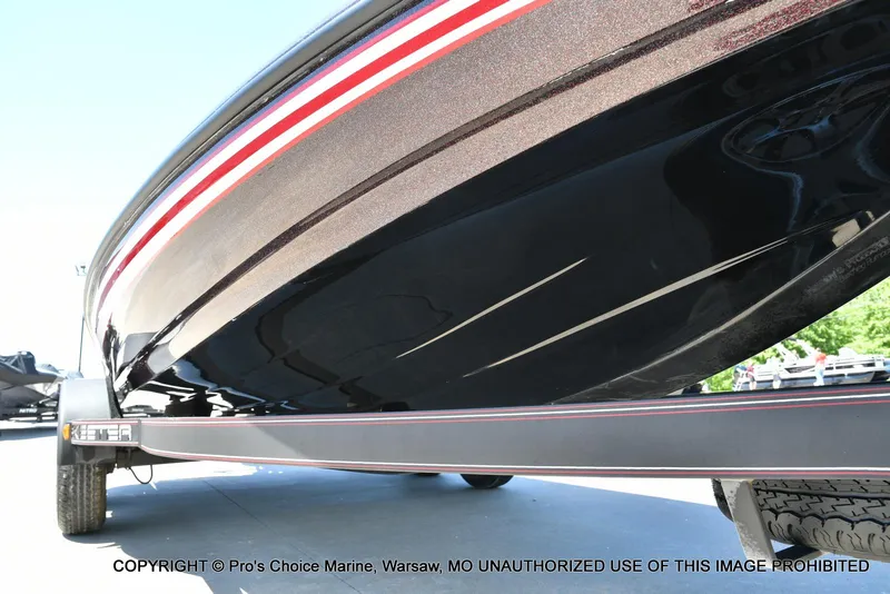 Slide: The Image of 2013 Skeeter ZX200 boat on trailer, close-up of hull with red and white stripes. - 30