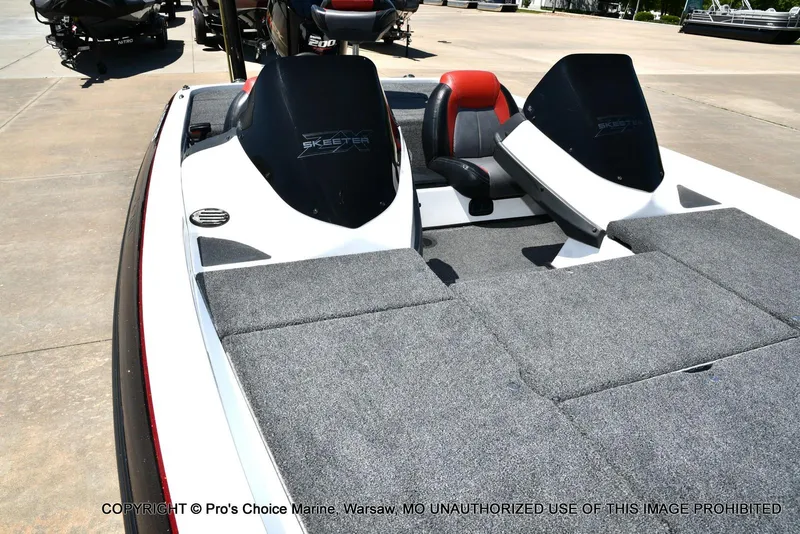 Slide: The Image of 2013 Skeeter ZX200 boat with gray carpeted deck and dual seats. - 32