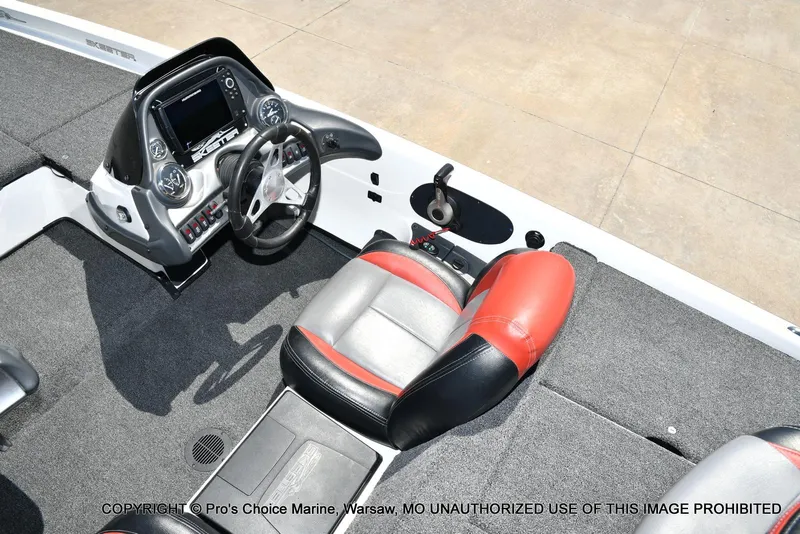 Slide: The Image of 2013 Skeeter ZX200 boat interior with steering console and red-black seating. - 39