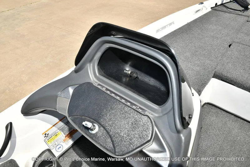 Slide: The Image of 2013 Skeeter ZX200 boat dashboard with storage compartment, featuring gray and black design. - 46