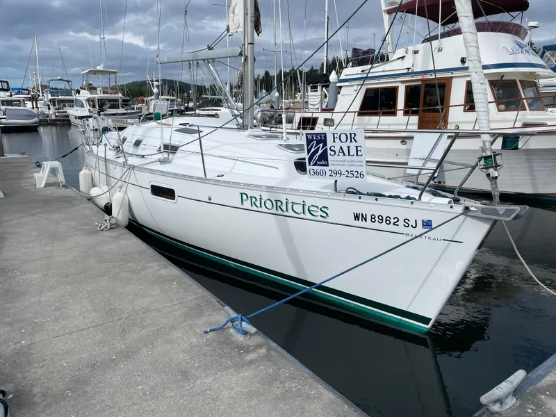 The Image of 2000 Beneteau Oceanis 321 sailboat docked, for sale sign visible. - 0