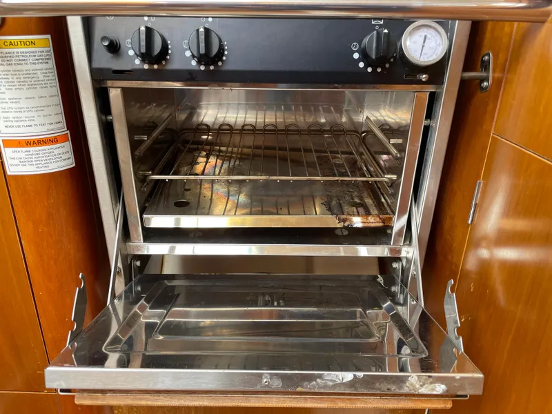 Slide: The Image of Stainless steel oven in a 2000 Beneteau Oceanis 321 yacht kitchen. - 12