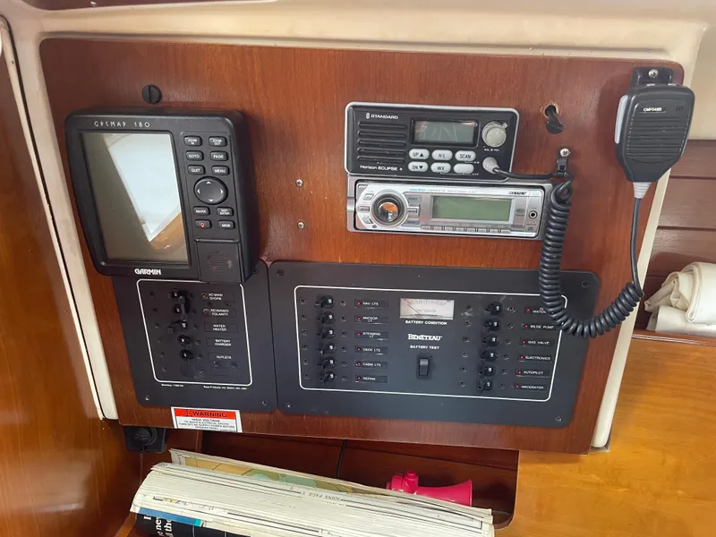 Slide: The Image of Control panel of a 2000 Beneteau Oceanis 321 sailboat with navigation and communication equipment. - 26