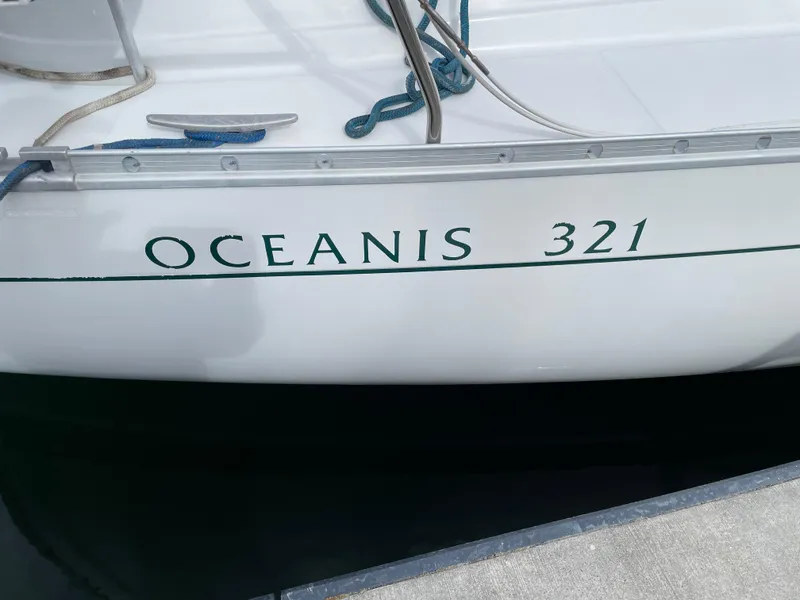Slide: The Image of Beneteau Oceanis 321 sailboat, 2000 model, docked with visible ropes and hull. - 4