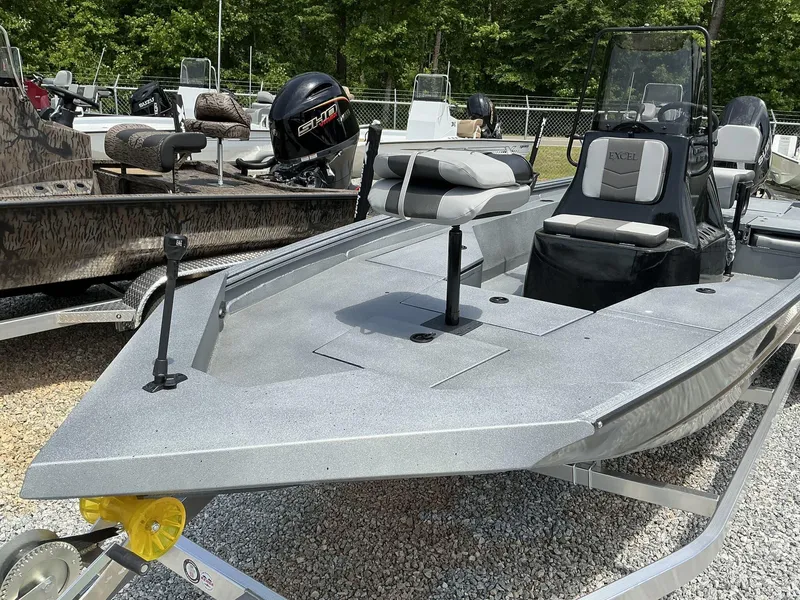 Slide: The Image of 2025 Excel Bay Pro 203 Elite boat on trailer, parked outdoors. - 3